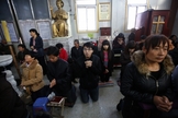 Cristãos se reúnem durante final de semana, em uma igreja subterrânea, na região de Tianjin (China).