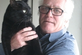Patrick Greene e seu gato, Big Boy, posando para câmera. Foto: Reprodução.