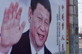 Outdoor em Pequim com a imagem de Xi Jinping, presidente e secretário-geral do Partido Comunista da China. (Foto: Greg Baker/AFP)