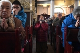 Cristãos participam de culto na China. (Foto: Greg Baker/AFP)