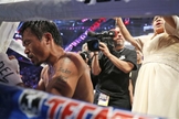 Manny Pacquiao em oração após disputa pelo título dos meio-médios em Macau, na China, em 2014. (Foto: AP)