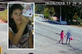 A menina Raíssa de mãos dadas com adolescente, em Perus. (Foto: Reprodução/TV Globo)