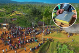 Moradores de uma região remota de Papua-Nova Guiné se reúnem para receber o Novo Testamento traduzido para a língua Onobasulu. (Captura de tela/CBN News)