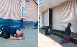 Com as lojas fechadas, comerciantes se ajoelharam em oração. (Foto: Reprodução)