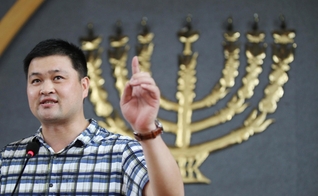 Pastor Huang Yizi, de 40 anos, preso por ir contra uma campanha de demolições de igrejas. (Foto: Scmp/ Simon Song)