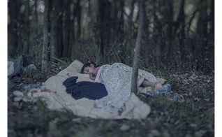 Criança refugiada síria dormindo