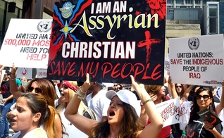 Cristãos assírios protestam contra a perseguição religiosa. (Foto: Michael Schmidt/Sun-Times)