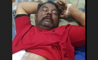 Nadeem Joseph após ser ferido a bala por muçulmanos. (Foto: Reprodução / Herald Malaysia)