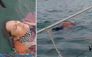 Angélica Gaitan é resgatada por pescadores após 8 horas no mar. (Foto: Rolando Visbal Lux / Newsflash)