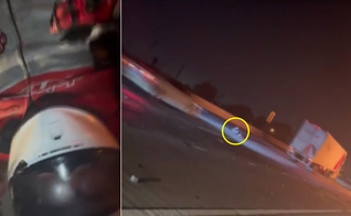 O motociclista corria risco de ser atropelado na rodovia. (Foto: Captura de tela/CBS News Los Angeles)