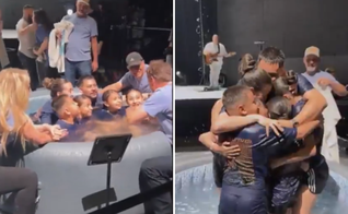 Família é batizada unida e celebra momento de fé. (Captura de tela/X/Jesus Saves Us)