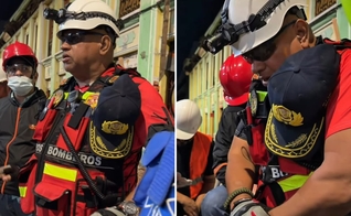 Os socorristas orando em meio aos destroços. (Foto: Reprodução/Instagram/Eduardo Menoni)
