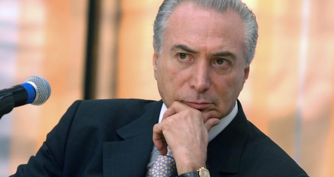 Questionado sobre ligação com satanismo, Michel Temer afirma que sua conduta é formada por valores cristãos. (Foto: Veja)