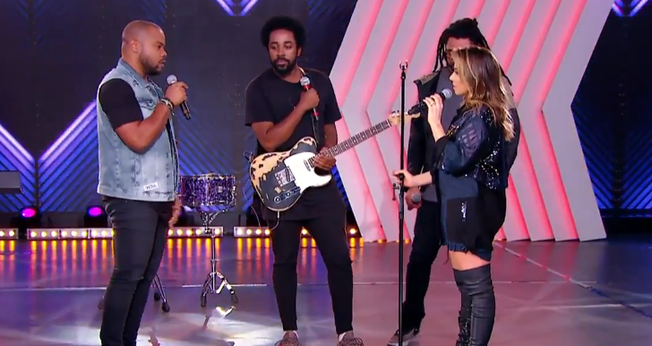 O grupo cantou "Fé na Vida" e o hit "Ninguém Explica Deus". (Foto: Reprodução).