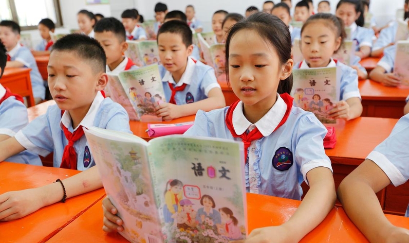 Crianças chinesas em sala de aula. (Foto: Reprodução/The National)