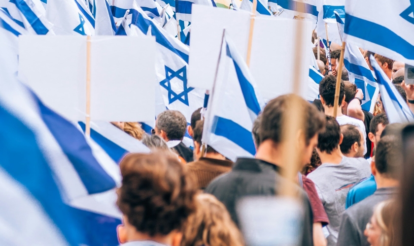 Bandeiras de Israel durante manifestação em apoio ao país. (Foto representativa: Yoav Aziz/Unsplash)