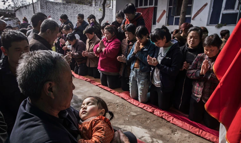 Depois de anos sendo perseguidos pelo governo comunista chinês, 60 membros da Igreja Reformada Santa fugiram para a Coréia do Sul. (Foto: Kevin Frayer/Getty Images).